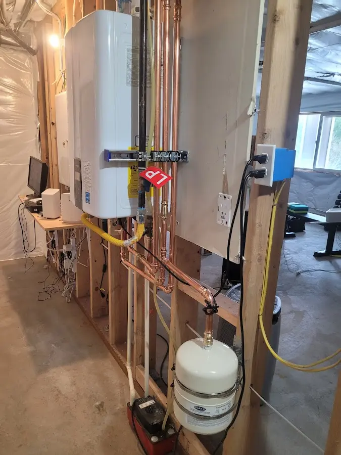 Licensed plumber repairing a kitchen sink in Mineola